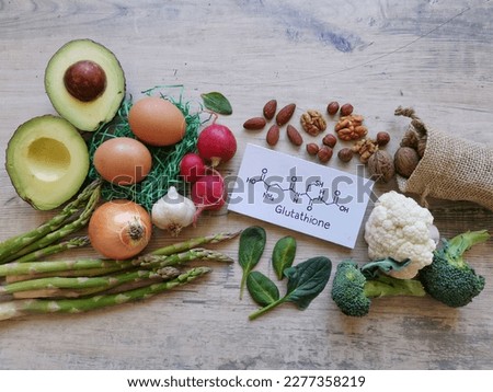 Foods rich in glutathione with structural chemical formula of glutathione. Healthy foods to boost glutathione. It is a tripeptide (protein), and it acts as an antioxidant. Royalty-Free Stock Photo #2277358219