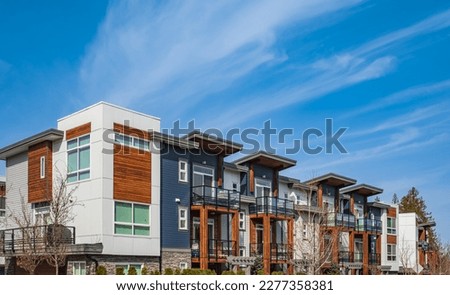 New residential townhouses. Modern apartment buildings in Canada. Modern complex of apartment buildings. Concept of real estate development, house for sale and housing market Royalty-Free Stock Photo #2277358381