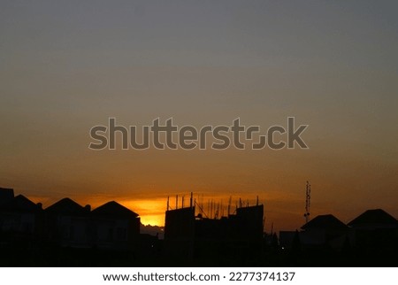 Low Angle View Of Silhouette Houses Against Sky During Sunset