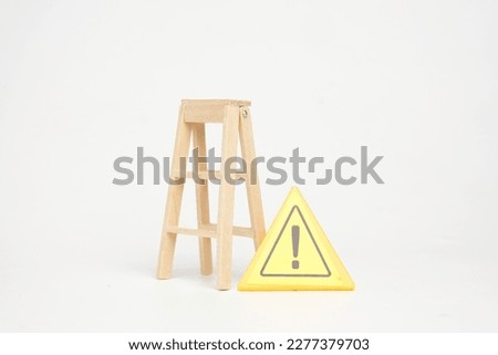 A picture of ladder and hazard warning sign. Working hazard concept.