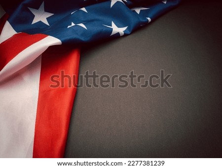 Part of the American flag is on a vintage background. Space for text. USA flag for Memorial Day, 4th of July, or Labour Day, etc. Close-up photo. Flat lay. Top view