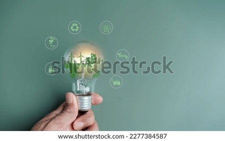 CO2 reduction icon with on lightbulb earth decrease CO2 or carbon dioxide emission, carbon footprint and carbon credit to limit global from climate change, Earth for develop green energy Royalty-Free Stock Photo #2277384587