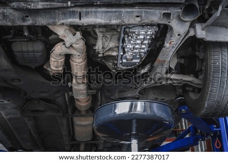 Automatic transmission service in garage shop. Royalty-Free Stock Photo #2277387017