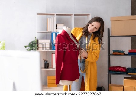 Female fashion designer are designing new trendy clothing collection.