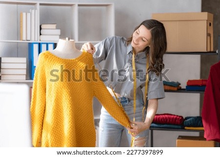 Female fashion designer are designing new trendy clothing collection.