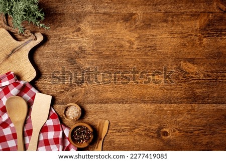 Old wooden kitchen utensils or cooking tools and bowls on wooden background, top view, flat lay. Kitchenware collection with copy space. Cooking background. Royalty-Free Stock Photo #2277419085
