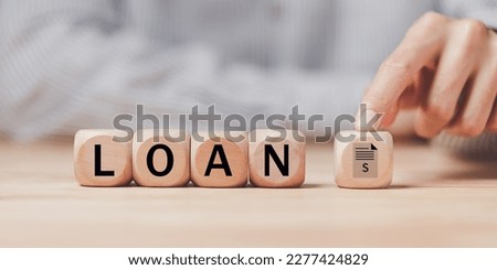 man pointing at a wooden block ,received banking loan approval ,Approval of a mortgage loan or purchase of real estate ,applying for financial credit,Financial loan agreement ,Mortgage application

