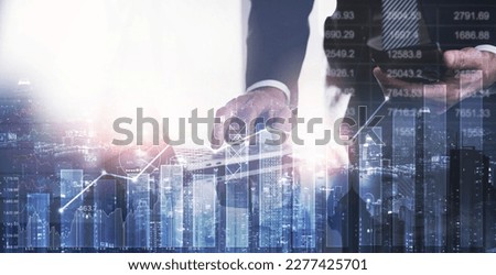 Businessman using laptop computer analyzing sales data, financial report and economic growth graph chart. Business strategy and solution. Digital marketing and business growth