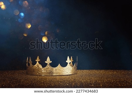 low key image of beautiful queen or king crown over glitter table. fantasy medieval period Royalty-Free Stock Photo #2277434683