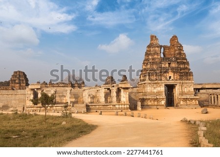 Medieval Vijaya Vitthala stone temple with intricate artwork at Hampi Karnataka, India