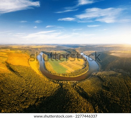 An impressive bird's eye view of the meander of the Dnister river. Location place Dniester canyon national park, Ukraine, Europe. Aerial drone shot. Photo wallpaper. Discover the beauty of earth.