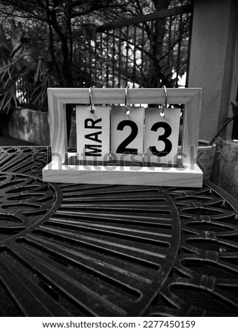 Simple style wooden hanging calendar in selective focus