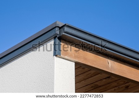 House rain grey gutter waterproofing home corner roof facade