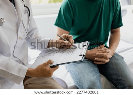 male health checkup with doctor Doctors consult about diagnosis of male diseases or mental illnesses in medical clinics or mental health facilities in hospitals. Royalty-Free Stock Photo #2277482801