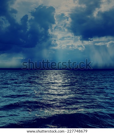 dramatic sky with clouds over dark sea
