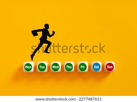 Looking forward to weekend holiday concept. Silhouette of a businessman running on days of week on wooden cubes to reach the weekend holiday.