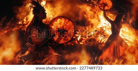 beautiful shamanic girl playing on shaman frame drum in the nature. Royalty-Free Stock Photo #2277489733