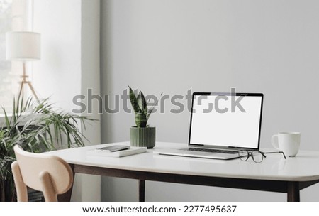 Workplace, laptop computer with empty display on desk. Royalty-Free Stock Photo #2277495637