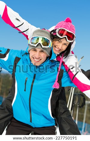 Portrait of happy couple of alps skiers have fun. Concept of winter sports and cute vacations