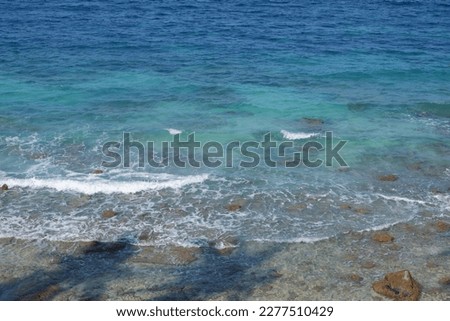 View of the sea surface and waves. Beautiful water background texture for tourism and advertising. Tropical beach