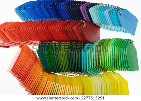 variety of multicolred plastic color samples in a chain Royalty-Free Stock Photo #2277515251