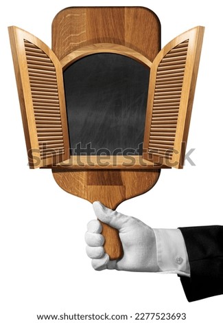 Hand of waiter or chef with white work glove holding an old wooden cutting board with a open window (blackboard inside), isolated on white background, template for recipes or food and drink menu.