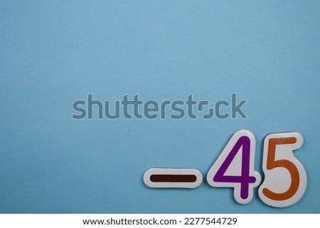 -45 is a colorful photo of -45 from the top, placed on the edge of a blue background.