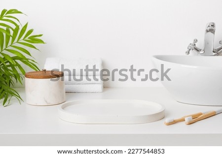 Bathroom sink table with empty stand and morning hygiene accessories Royalty-Free Stock Photo #2277544853