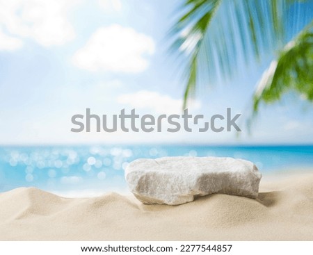 Summer sand and tropical sea background with abstract stone podium Royalty-Free Stock Photo #2277544857