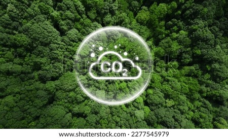 Reduce CO2 emissions to limit climate change and global warming. Co2 text in bubbles with forest.carbon dioxide CO2 molecules. Low greenhouse gas levels, decarbonize, net zero carbon dioxide footprint Royalty-Free Stock Photo #2277545979