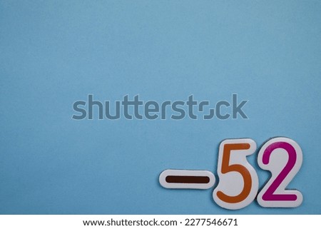 -52 is a colorful photo of -52, taken from above, placed on the edge of a blue background.