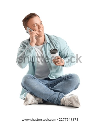 Young man talking by smartphone on white background