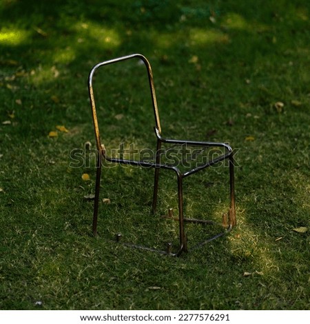 rusted steel chair frame in a garden