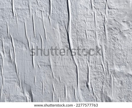 White empty weathered peeling wrinkled  paste up street poster placard layer   Royalty-Free Stock Photo #2277577763