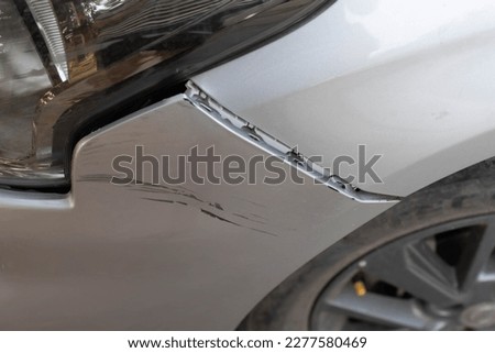 Traces of abrasive paint from a car accident. The car's paint is damaged by scraping. Royalty-Free Stock Photo #2277580469
