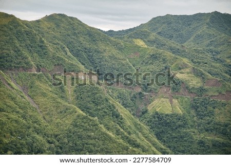 The majestic valley of Banaue in the Philippines with its imposing tree-covered hills.
