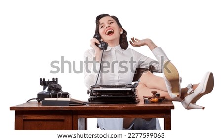 Lazy rude vintage style secretary with feet up on office desk, she is gossiping on the phone Royalty-Free Stock Photo #2277599063