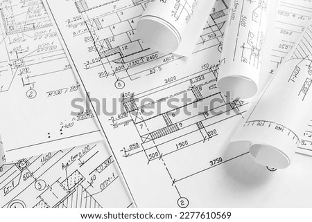 Architects concept, engineer architect designer freelance work on start-up project drawing, construction plan architect design working drawing sketch plans blueprints and making construction model Royalty-Free Stock Photo #2277610569