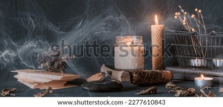 Tarot, astrology,Esoteric, Occult mystical ritual scene of sorcery tarot candles,dried flowers, palo santo tarot cards, ritual book.Witchcraft,mysticism and occultism,esoteric background,tarot banner Royalty-Free Stock Photo #2277610843