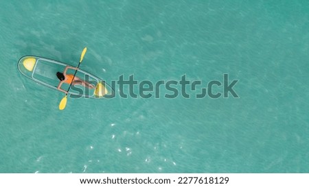 Asian woman travel Pataya by use kayak boat togather on on clean sea water from top view in Thailand Royalty-Free Stock Photo #2277618129
