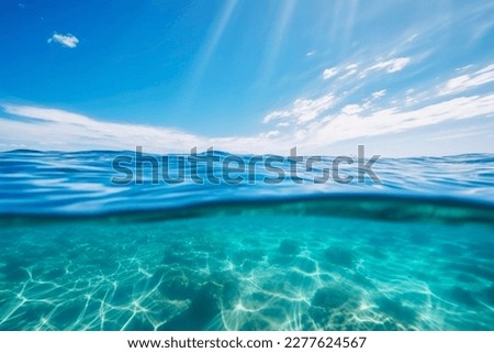 Blue sea ocean water surface and underwater with sunny and cloudy sky,seascape summer background wallpaper. Royalty-Free Stock Photo #2277624567