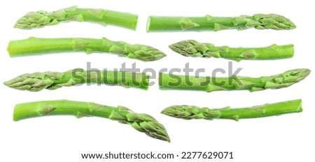 Green asparagus sprouts on white background. Clipping path. Royalty-Free Stock Photo #2277629071
