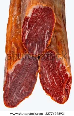 Spanish meat delicacy from pork dry-cured carbonade Lomo Curado Royalty-Free Stock Photo #2277629893