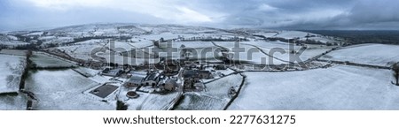 snowy landscape border between yorkshire and cumbria rural fields winter ariel drone photography panorama