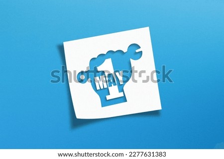 May 1 Labor Day concept on white note paper Royalty-Free Stock Photo #2277631383