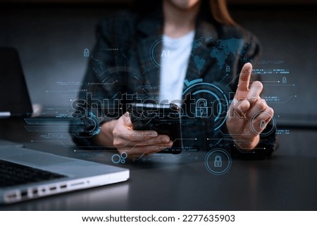 Cyber security and data protection. Business using computer and  tablet protecting business and financial data with virtual from cyber attack, cybersecurity technology in modern office
