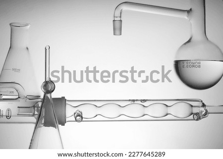 Back light concept with transparent laboratory glassware containing water. Concept of science, production of cosmetics Royalty-Free Stock Photo #2277645289