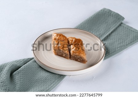 Pistachio baklava. Close-up. Traditional Middle Eastern Flavors. Traditional Turkish baklava. local name fistikli baklava Royalty-Free Stock Photo #2277645799