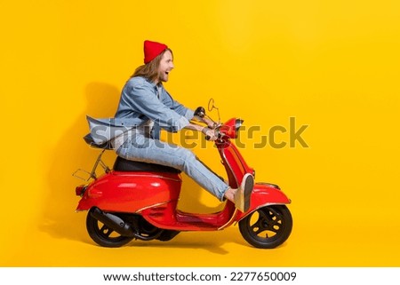 Full length photo of excited funky guy dressed jeans driving vehicle looking emtpy space isolated yellow color background Royalty-Free Stock Photo #2277650009
