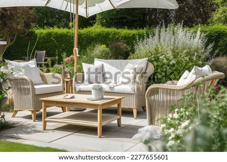 Charming Serene Garden Patio With Cozy Outdoor Furniture, Accent Pillows and Relaxing Setting Royalty-Free Stock Photo #2277655601